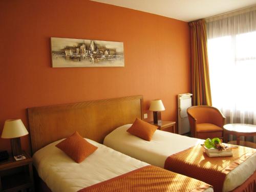 Ένα ή περισσότερα κρεβάτια σε δωμάτιο στο Le Grand Monarque