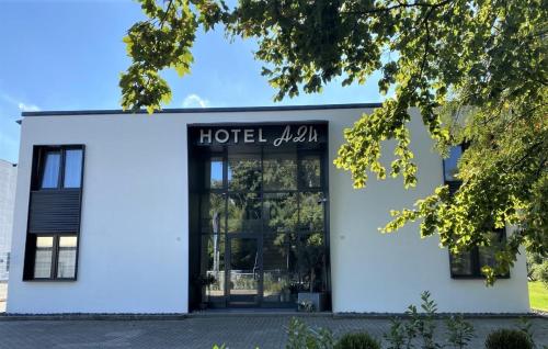 a white building with a sign that reads hotel oxygen at Hotel A24 bei Hamburg in Glinde