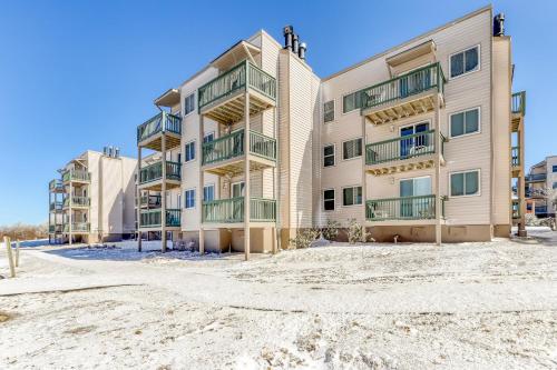 a large apartment building on the beach with a sandy street at Pinnacle in Beech Mountain