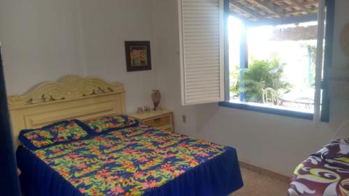 Ένα ή περισσότερα κρεβάτια σε δωμάτιο στο Casa em Cabo Frio