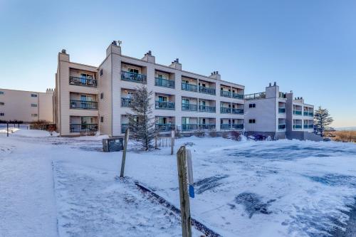 a large building with snow in front of it at Pinnacle in Beech Mountain
