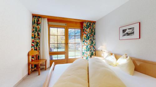 Postel nebo postele na pokoji v ubytování Mountain Escape Apartment for 5 in Leukerbad
