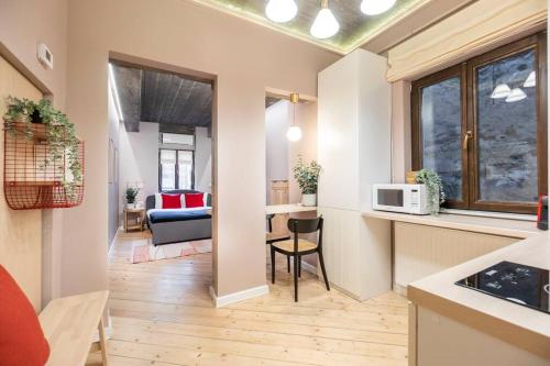 a room with a kitchen and a living room at Marvellous Design Studio Old Town in Bucharest