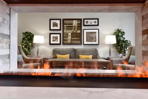 a living room with a couch and a table at Staybridge Suites - Waterloo - St. Jacobs Area in Waterloo