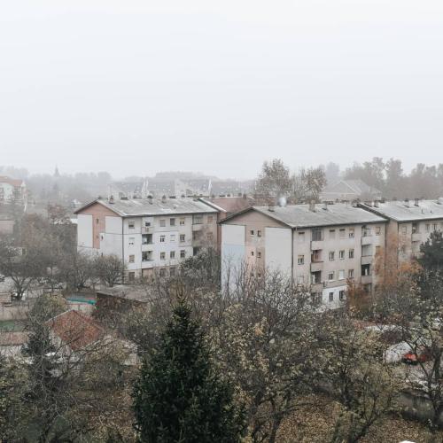 a group of apartment buildings in a city at Gold apartman in Sombor