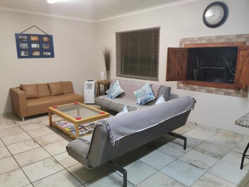 a living room with a couch and a coffee table at Langebaan Escape Self Catering Accommodation in Langebaan