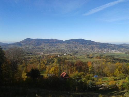 a view of a valley with mountains in the background at Luxusní horský apartmán v Beskydech in Malenovice