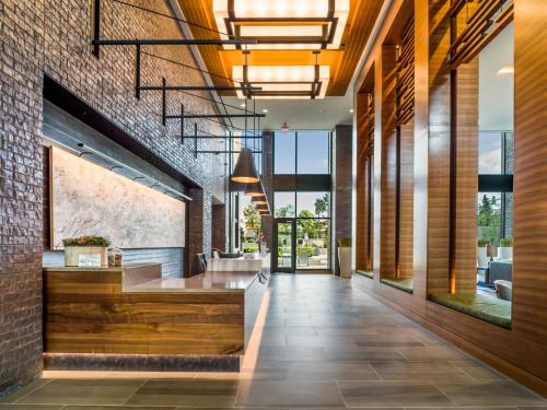 a lobby of a building with a brick wall at Bluebird Suites at Reston Town Center in Reston