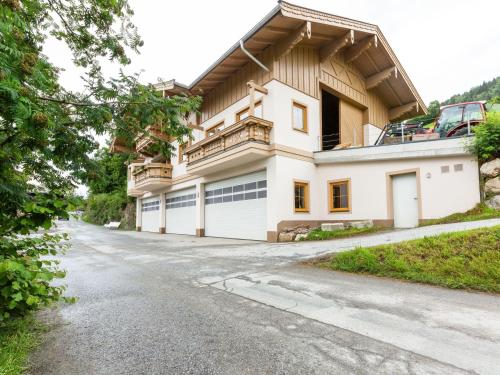 a large white house with a driveway at Spacious Villa with Sauna in Mittersill in Mittersill