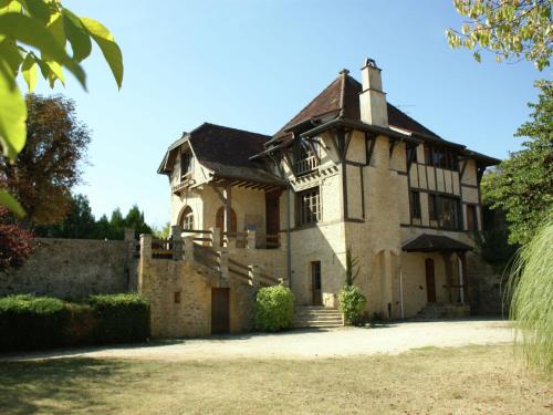 an old stone house with a turret at Sumptuous Mansion in Belves with Pool in Belvès