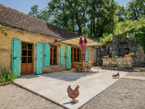 a house with chickens standing outside of it at Mansion in Lavercanti re with Private Pool in Lavercantière
