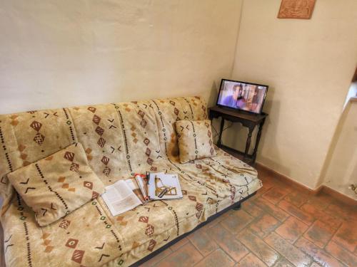 A television and/or entertainment centre at Farmhouse in Proceno with Pool and Terrace