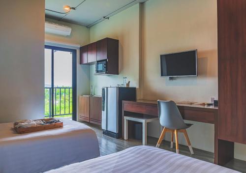 Una cama o camas en una habitación de Bhava Residence