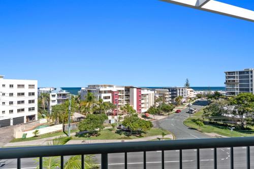 a view of a city from a balcony at Kings Bay Apartments in Caloundra