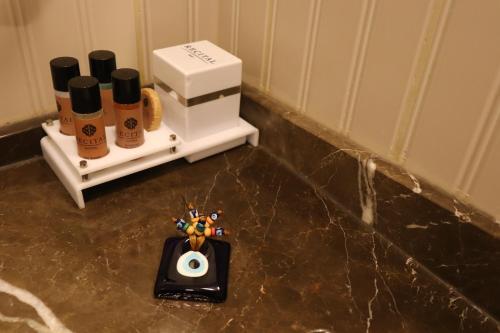 a bathroom with a pile of products on a counter at Recital Hotel in Istanbul