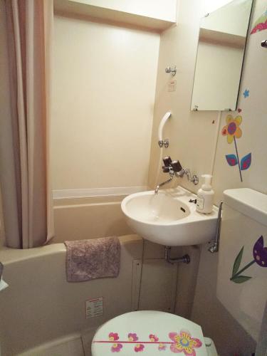 a small bathroom with a sink and a toilet at Free bike and free WIFI 204 Take it easy in Kyoto