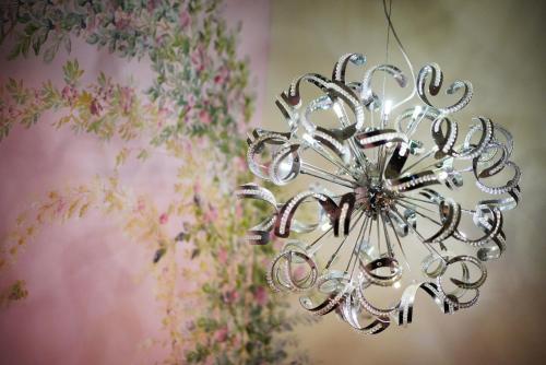 a silver chandelier hanging from a wall at Sa-Yo Hotel - Pier 2 in Kaohsiung