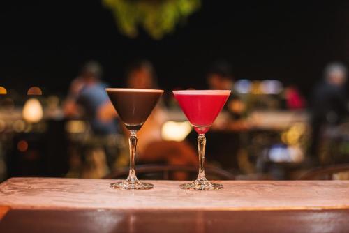 two wine glasses sitting on top of a table at SureStay Hotel by Best Western Vientiane in Vientiane