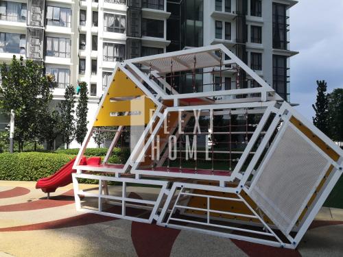 a play structure in front of a building at Spacious Big Room, Designed & Quiet Family Home, Eclipse in Cyberjaya by Flexihome-MY in Cyberjaya
