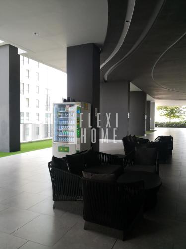 a lobby with chairs and a sign that reads lexotechnology at Spacious Big Room, Designed & Quiet Family Home, Eclipse in Cyberjaya by Flexihome-MY in Cyberjaya
