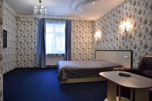 a hotel room with a bed and a window at Hotel Т2 in Kyiv