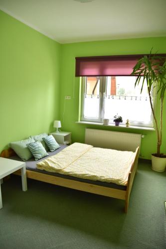 Posteľ alebo postele v izbe v ubytovaní Apartament Centrum