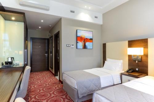 Postel nebo postele na pokoji v ubytování Hotel Senator