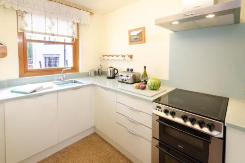 A kitchen or kitchenette at Langstrath, Chapel Stile