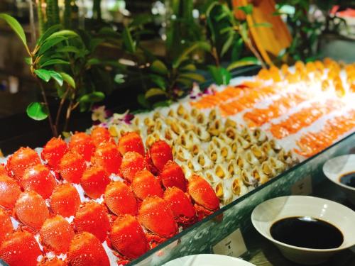 a display of fruits and vegetables on a buffet at Pullman Changshu Leeman in Changshu