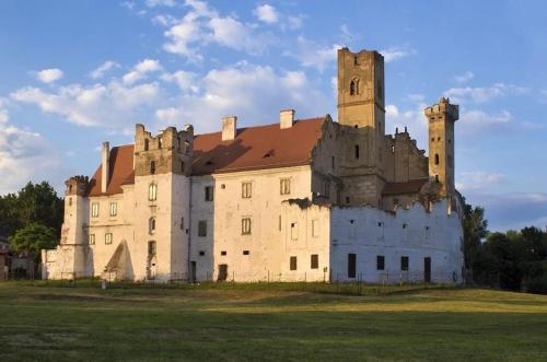 an old castle sitting on top of a field at Hostel Tereza Břeclav in Břeclav