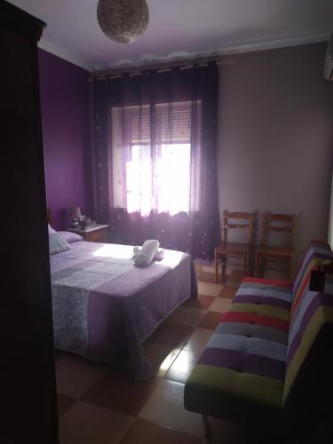 Ένα ή περισσότερα κρεβάτια σε δωμάτιο στο Hostal Andalucia de Arcos