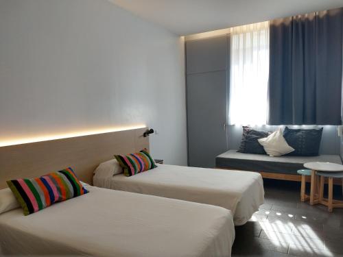 Кровать или кровати в номере Centre Esplai Albergue