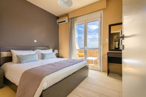 A bed or beds in a room at Theo Villas