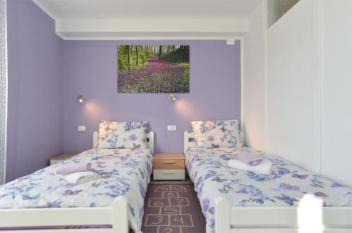 Postel nebo postele na pokoji v ubytování House Roza 2065
