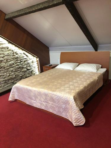 Cama ou camas em um quarto em Guest House na Velikoy