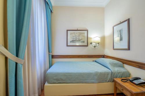 Hotel Michelangeloにあるベッド