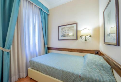 Hotel Michelangeloにあるベッド