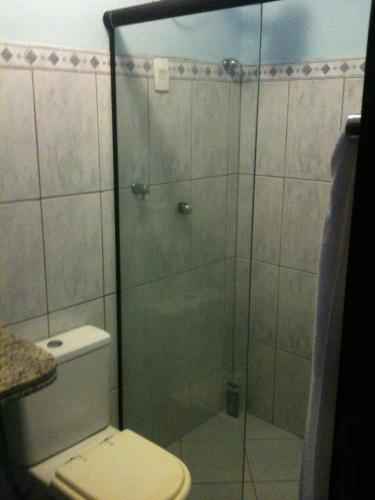 a bathroom with a glass shower with a toilet at PontaNegra PontadoSolluciene 4B in Natal
