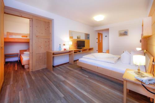 Postel nebo postele na pokoji v ubytování Hotel Valpudra