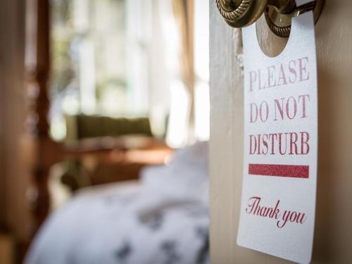 a sign on a door that says please do not disturb at Elim House - Adults Only in Bowness-on-Windermere