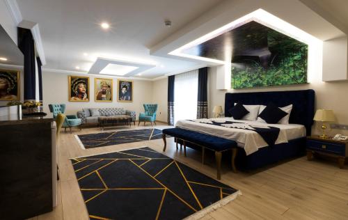 A bed or beds in a room at Florya Novi Hotel