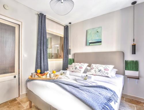 a bedroom with a bed with a tray of fruit on it at 834 - Spacious flat in Paris Olympic Games 2024 in Paris