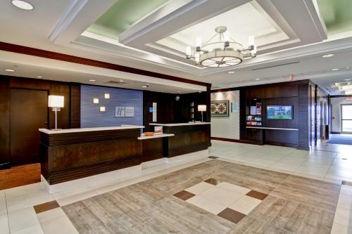a lobby of a hotel with a reception desk at Holiday Inn Express Hotel & Suites Waterloo - St. Jacobs Area, an IHG Hotel in Waterloo