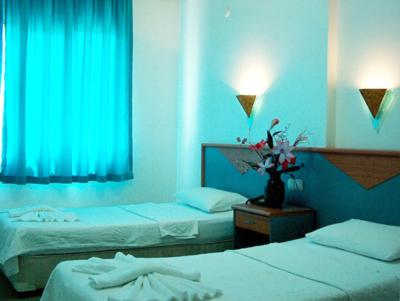Postel nebo postele na pokoji v ubytování Blue Yacht Marina Apart Hotel