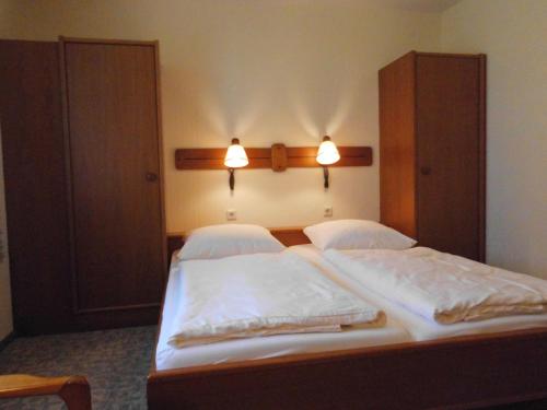 Katil atau katil-katil dalam bilik di Land gut Hotel Dierks