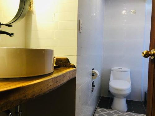 a bathroom with a sink and a toilet at Hotel Boutique Casa de las Manrique in Guanajuato