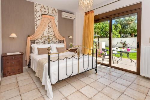 A bed or beds in a room at Cretan Blu Platanias