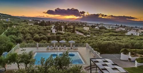 arial view of a villa with a swimming pool at Cretan Blu Platanias in Plataniás
