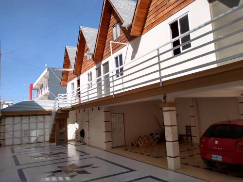 a house with a car parked in front of it at GoEs Loft in Comitán de Domínguez