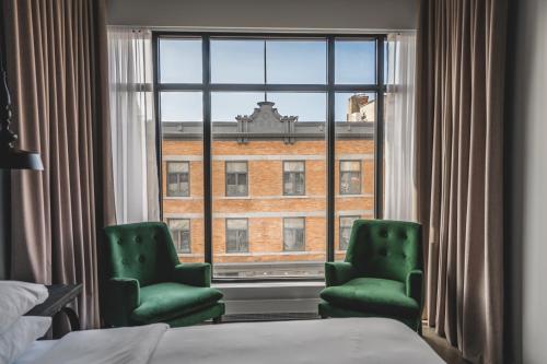 Postel nebo postele na pokoji v ubytování Hotel Oui GO!